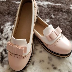 Pink & white leather wingtip Oxfords.